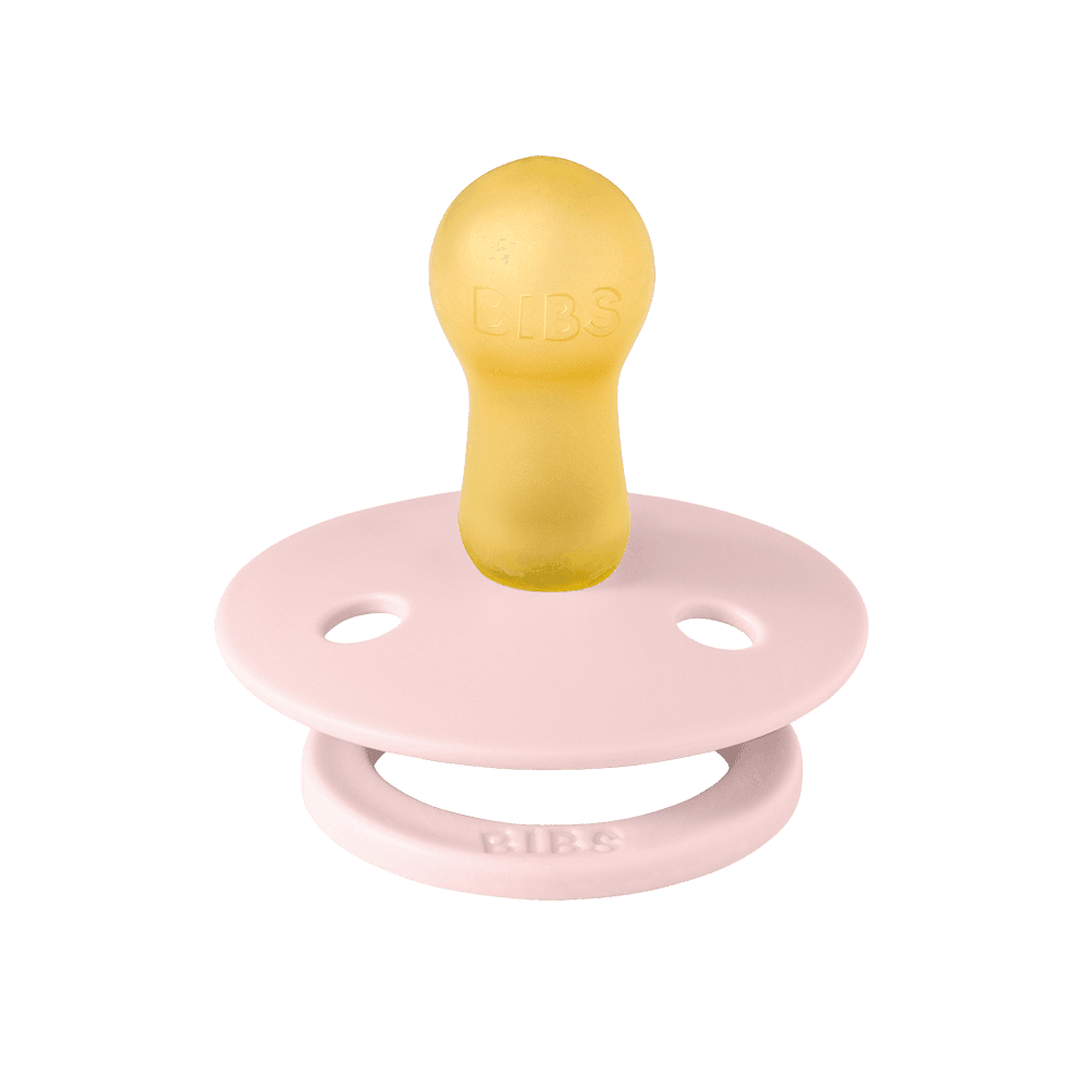 light pink round latex pacifier from bibs